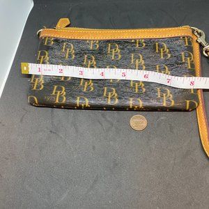 Dooney and Bourke Wristlet purse with red interior 1975 signature RETRO